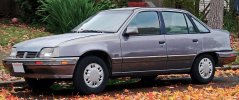 1992_Pontiac_LeMans_SE_Sedan_in_Grey,_Front_Left.jpg