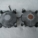 Low end cooler on left: The heatsink portion is made from solid aluminium, extruded and then machined. It measures 19mm thick, and 89mm at the widest point. The solid core is 29mm across, and this is the part that makes contact with the CPU heatspreader. The fins start at around 0.8mm thick, then split to two fins of approximately 0.4mm thickness. The entire assembly weighs 168 grams.